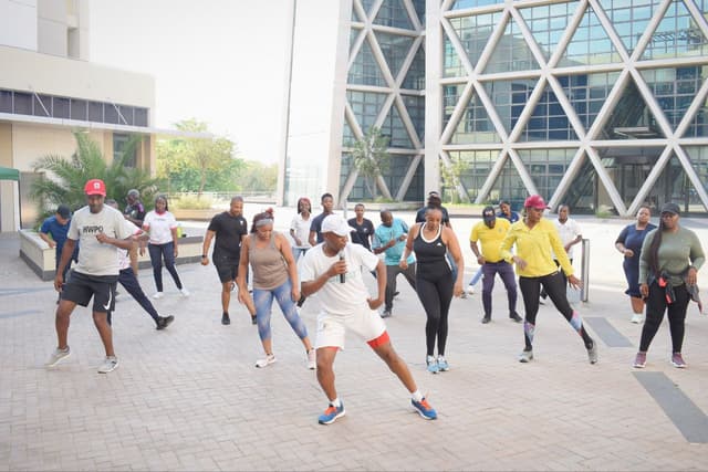 Physiotherapist demonstrating exercises at a sports event